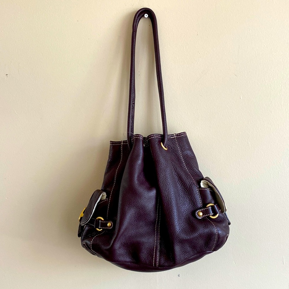 Lucē Purple Leather Drawstring Handbag with side pockets and gold buckles